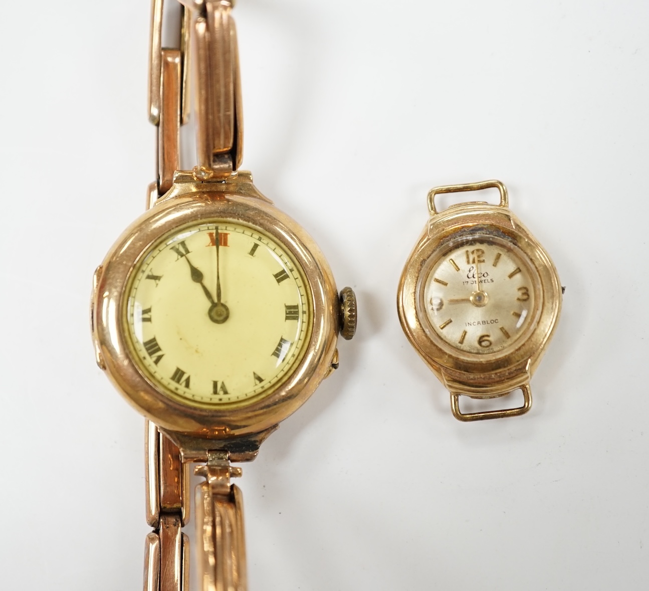 A lady's early 20th century 9ct gold manual wind wrist watch, on a 9ct expanding bracelet, gross weight 19.4 grams, together with a lady's 9ct gold Elco watch. Condition - poor